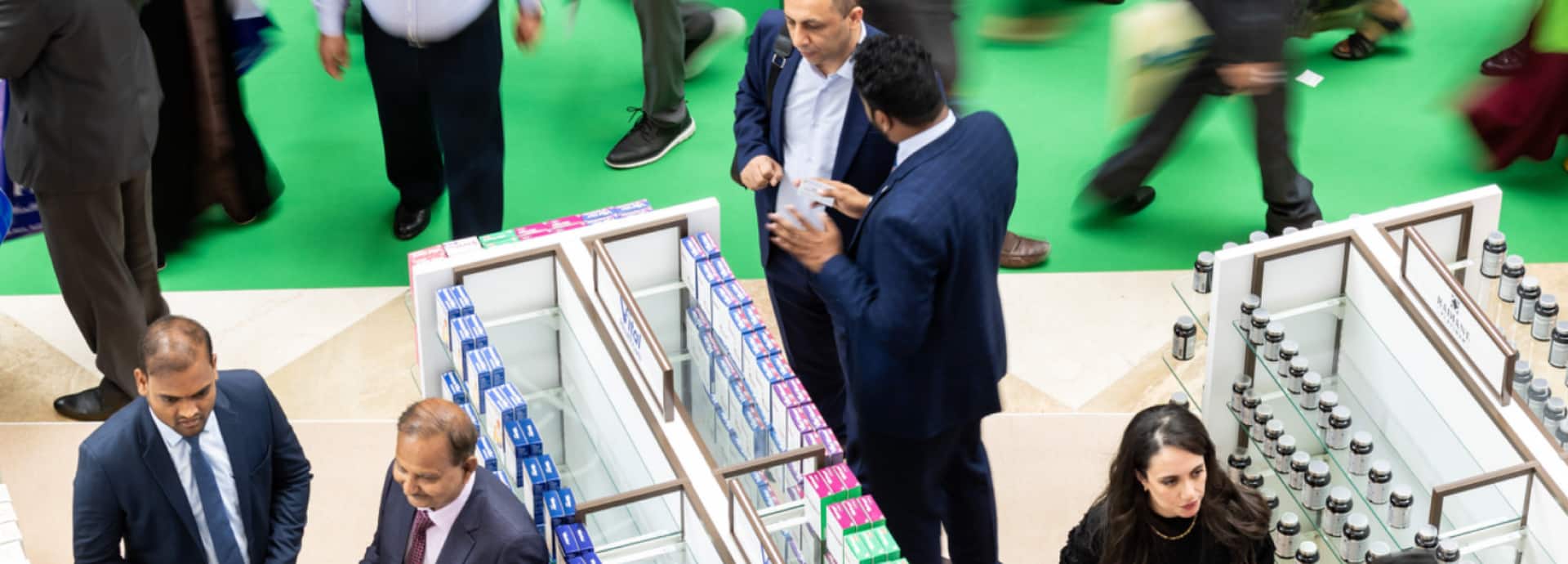  Delegates and attendees at an exhibitor stand