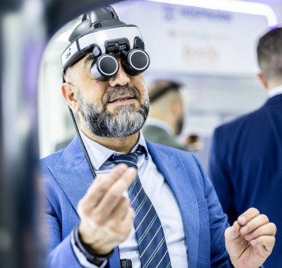 WHX attendee wearing a binocular loupe